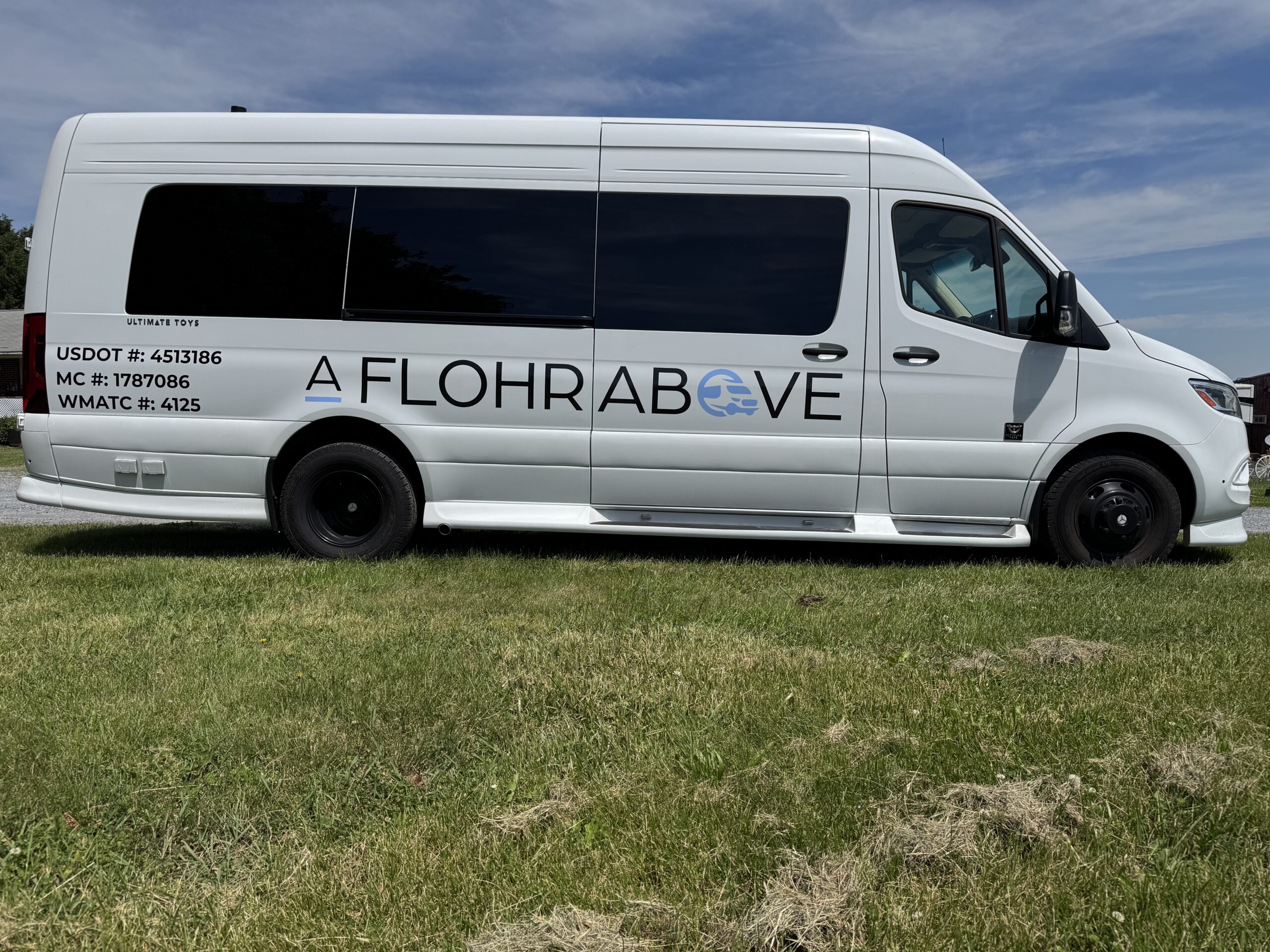 A side view of A Flohr Above's luxury van.